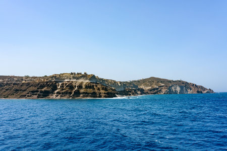 Tiny houses on top of Santorini islands in a deep blue sea. Greece in summer.の写真素材