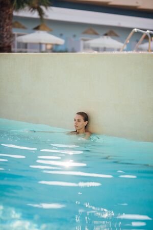 Young attractive woman in the poolの写真素材