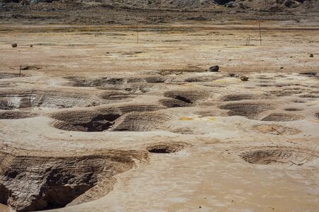 Hot geysers with mud and sulfur in the crater of a volcanoの写真素材