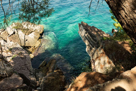 Rocky cliff for jumping in water or making scary selfies with extreme height and pure clean water of Adriatic sea.の写真素材