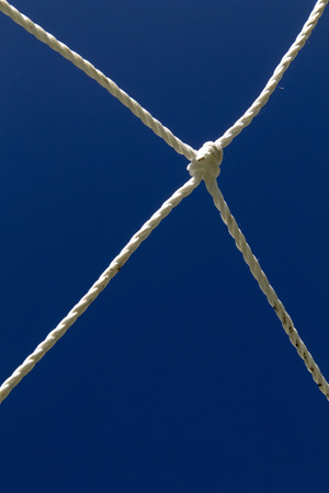 Soccer goal net on a blue skyの写真素材