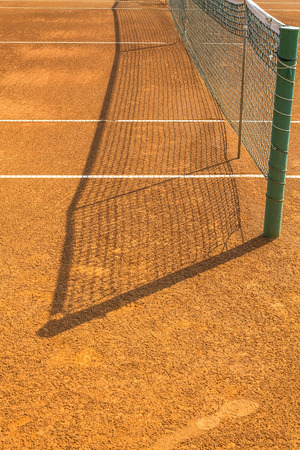 Empty tennis clay court on a sunny dayの写真素材