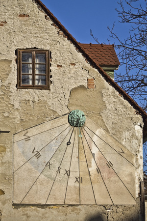 Vintage sun clock on a wall in Zagrebの写真素材