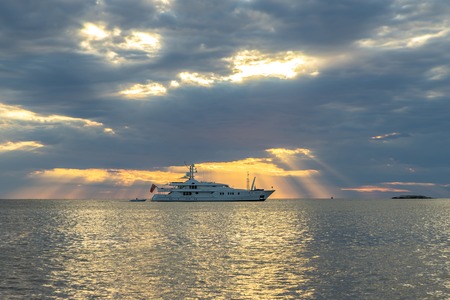 Sunset seascape with a luxury yacht in Croatiaの写真素材