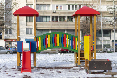 Empty playground in the public park in winterの写真素材
