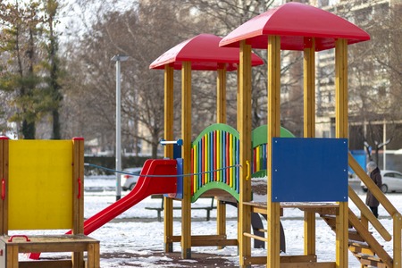 Empty playground in the public park in winterの写真素材