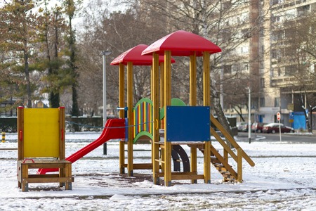 Empty playground in the public park in winter