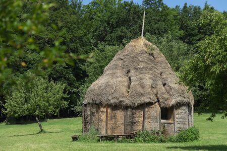 Old house made of hay on a sunny dayの写真素材
