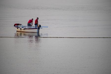 Fisherman on a small boat