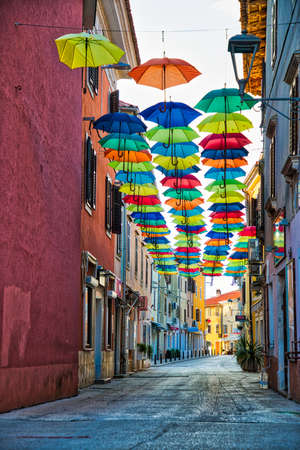 Street of Novigrad decorated with umbrellas in Croatiaのeditorial素材