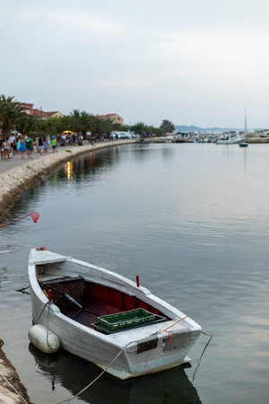 Small harbor with yacht and sail boats in Bibinje village at sunset in Croatiaの写真素材