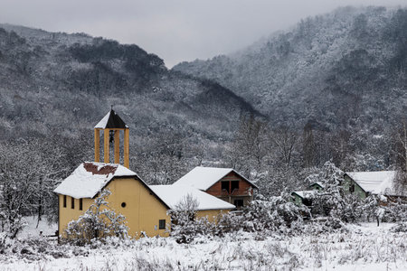 Small village in Croatia under the mountain in winterの写真素材