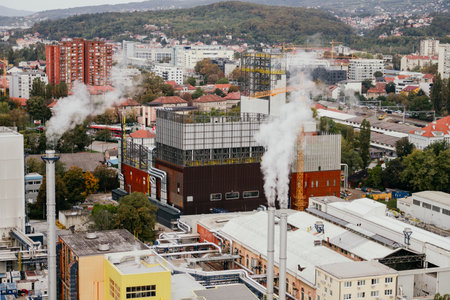 Industrial area of the city from a height, pollution of the city by the nearest factories and factories located within the cityの写真素材