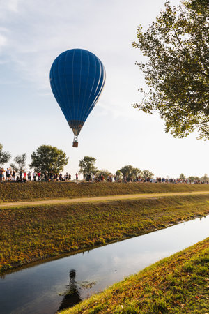 Colorful hot air balloons flying on a sunny dayの写真素材