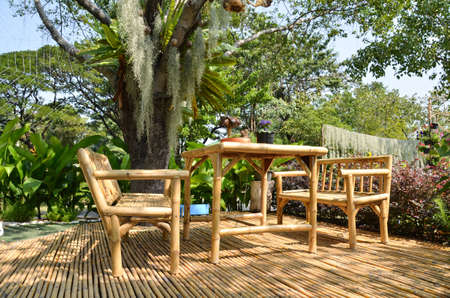 Bammboo furniture set on the bamboo floor for relaxing in the garden の写真素材