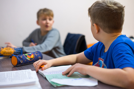 The brothers do their boring homework homework.の写真素材