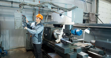 Factory woman worker doing practical work in the factory