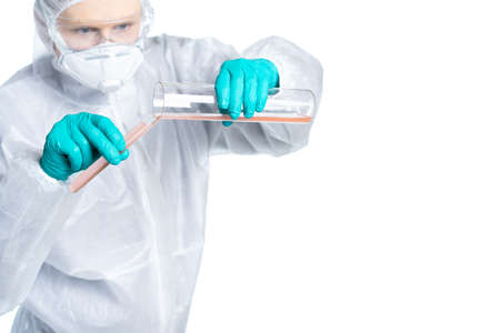 Infection Control Medical Specialist in protective suit and respirator mixes virus and antidote potions. Isolatedの写真素材