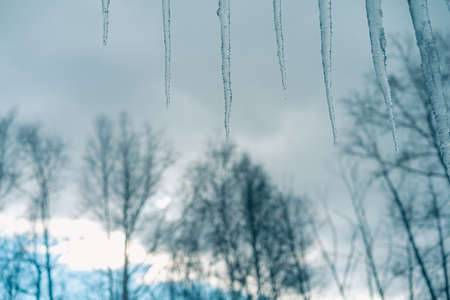 Car covered with ice and icicles after freezing rain. Ice covered car window close up. Bad winter weather, ice storm in November Vladivostok. Winter frosty scenes.の写真素材