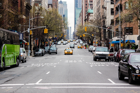 The street view of Upper East Side in New York city is not in a traffic jam on a working day.のeditorial素材