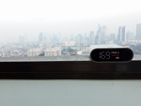 Air pollution detector shows the result from PM2.5 dust (Fine Particulate Matter) with background of...