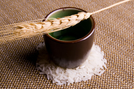 Wheat on top of porcelaine brown glass.の写真素材