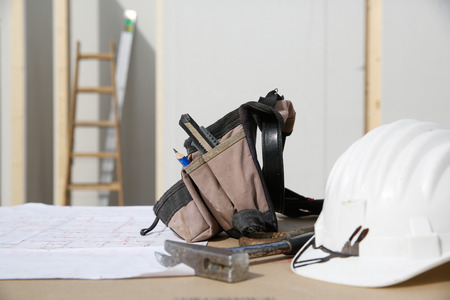 Building equipment and building plan: helmet, hammer, workerの写真素材