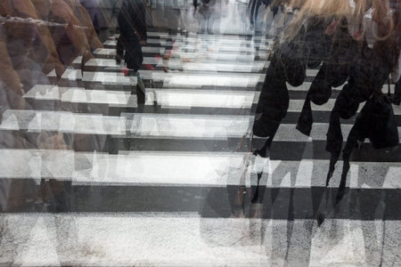 People crossing a road, hurrying, blurred motion