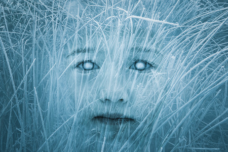 Spooky zombie child face. Halloween, horror, gothic themes. Double exposure.の写真素材