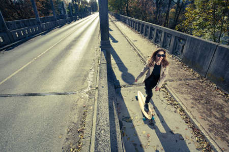 Active woman riding longboard. Urban lifestyle concept.の写真素材