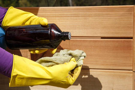 Oiling a new wooden raised garden bed. DIY concept.の写真素材