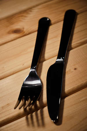 Cutlery on wooden backgroundの写真素材