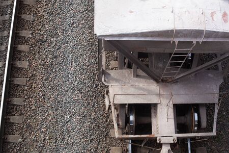 a freight train standing on the tracks waiting to be unloaded or loadedの写真素材