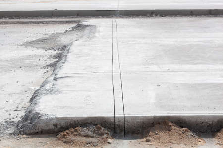 construction of a new road from concrete by technology, photo closeup from the construction siteの写真素材