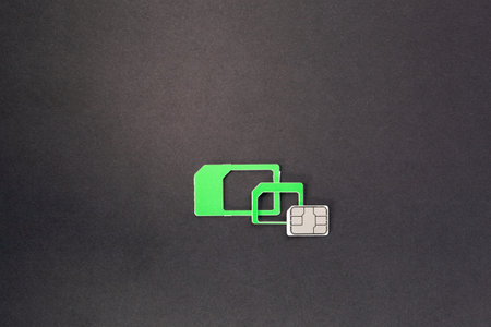 nano sim card extract from sim card adapters on dark black background