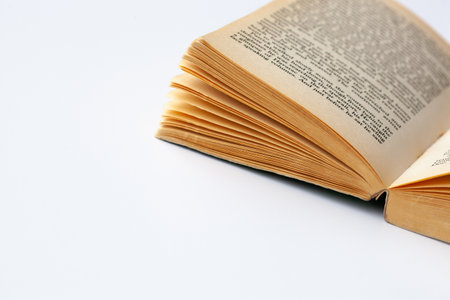 old open book with a ot of pages on white backgroundの写真素材