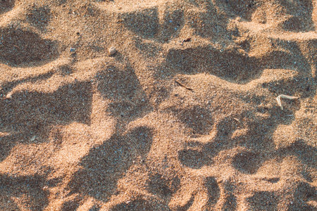 closeup of sand pattern of a beach in the summer. traveling concept