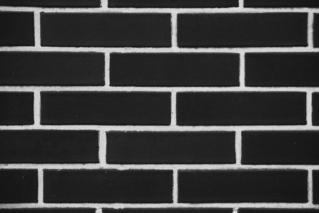 black and white contrast background from brick wall texture. background for designers.の写真素材
