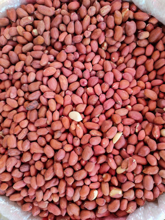 Pile of peanuts in sacks sold in the market.