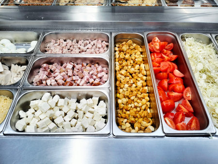 A diverse buffet featuring a wide array of food items such as tomatoes and cheese, showing the versatility of ingredients in various cuisinesの写真素材