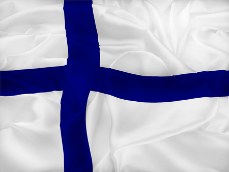 The flag of Finland, also called siniristilippu Blue Cross Flag, dates from the beginning of the 20th century. It features a blue Nordic cross, which represents Christianity.の写真素材