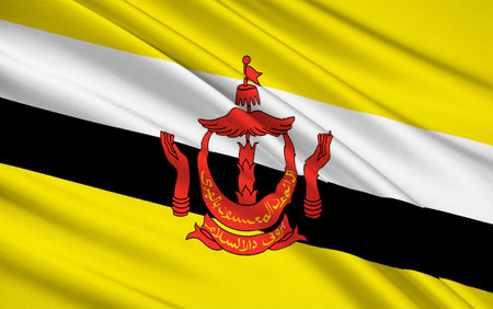 The national flag of The Sultanate of Brunei, a small, oil-rich sultanate on the northwest coast of Borneo. It became a fully independent Commonwealth state in 1984.の写真素材