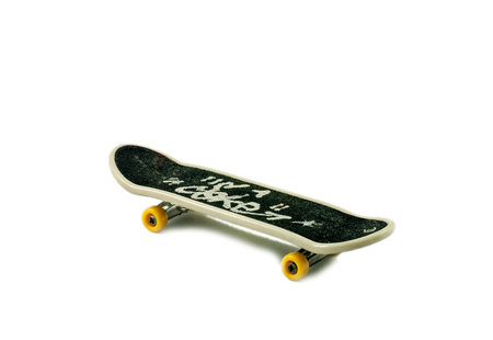 Fingerboard (small copy of skateboard) on white background with shadow.の写真素材