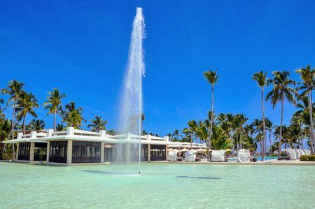 Punta Cana, Dominican Republic - March 26, 2010: Hotel Catalonia Royal Bavaro, Beach hotel resort swimming pool surrounded by palm trees.のeditorial素材