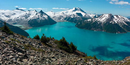 beautiful view of mountains and sweet water lake with green treesの写真素材