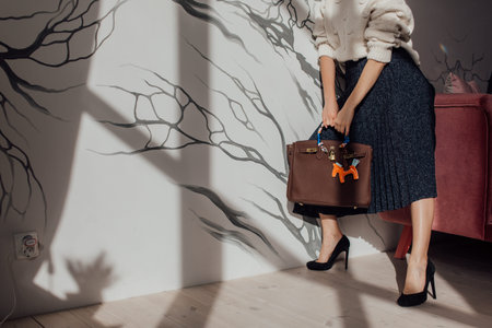 Multi-colored leather bags, in a room with a good interior and beautiful colored furniture,...