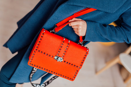 Multi-colored leather bags, in a room with a good interior and beautiful colored furniture,...