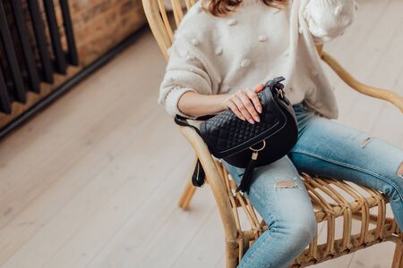 Multi-colored leather bags, in a room with a good interior and beautiful colored furniture, sometimes a girl is in the frameの写真素材