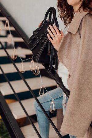 Multi-colored leather bags, in a room with a good interior and beautiful colored furniture, sometimes a girl is in the frameの写真素材