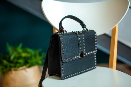 Multi-colored leather bags, in a room with a good interior and beautiful colored furniture,...